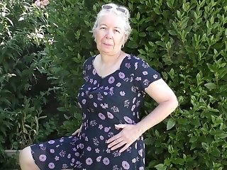 Sexy Granny Jiggles Her Ample Melons While Masturbating In The Garden